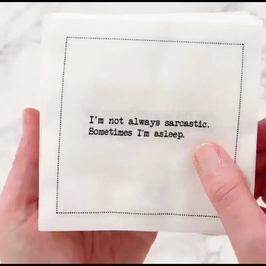 Video of a hand holding an organic cotton cocktail napkin printed with the quote "I'm not always sarcastic. Sometimes I'm asleep," from Five Star Napkins' Snarky quote collection