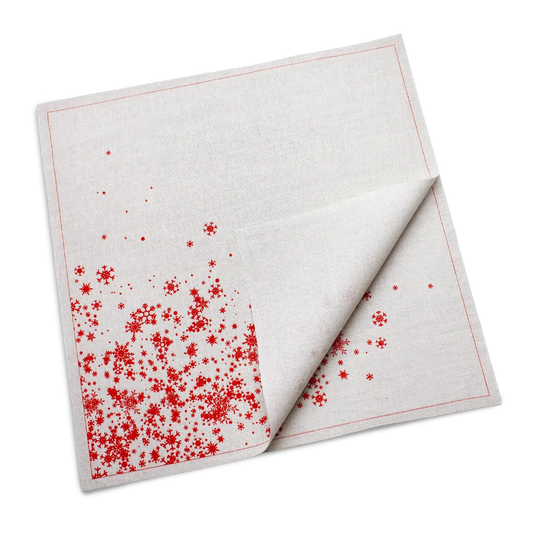 Folded natural organic cotton dinner napkin with a red snowflake print, by Five Star Napkins.