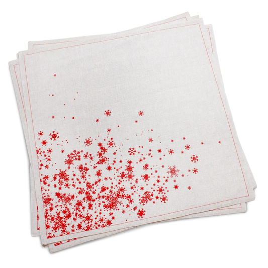 Stack of natural organic cotton dinner napkins with a red snowflake print, by Five Star Napkins.