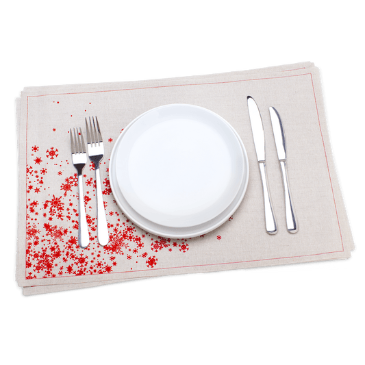 Luxury organic cotton placemat with red star design, set with plates and silverware