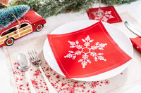 Persimmon organic cotton napkin with white snowflake design on holiday table setting