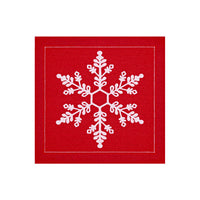 Red organic cotton napkin with white snowflake design, square fold, holiday theme