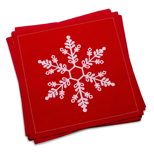 Stack of red organic cotton luncheon napkins printed with a white snowflake design, by Five Star Napkins.