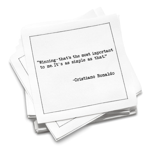 Organic cotton cocktail napkin stack printed with the quote “Winning, that’s the most important to me. It’s as simple as that,” from Five Star Napkins’ Soccer Legends quote collection.