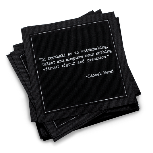 Black organic cotton cocktail napkins with a Lionel Messi quote, Five Star Napkins luxury design