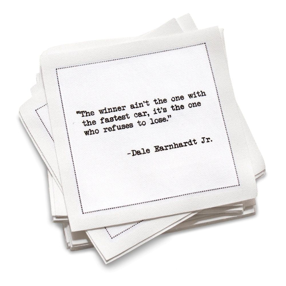 Stack of cotton cocktail napkins with a motivational quote by Dale Earnhardt Jr. on a white background