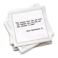 Stack of cotton cocktail napkins with a motivational quote by Dale Earnhardt Jr. on a white background