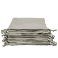 Stack of Anthracite Grey organic cotton pouches with drawstring closures
