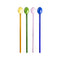 Four glass cocktail swizzle spoons in yellow, green, pink, and blue, standing upright against a white background.