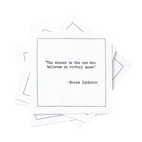 Stack of organic cotton cocktail napkins printed with the quote “The winner is the one who believes in victory more,” – Novak Djokovic, from Five Star Napkins’ Tennis Legends quote collection.