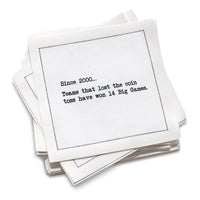 Stack of white cotton cocktail napkins with black text on a white background