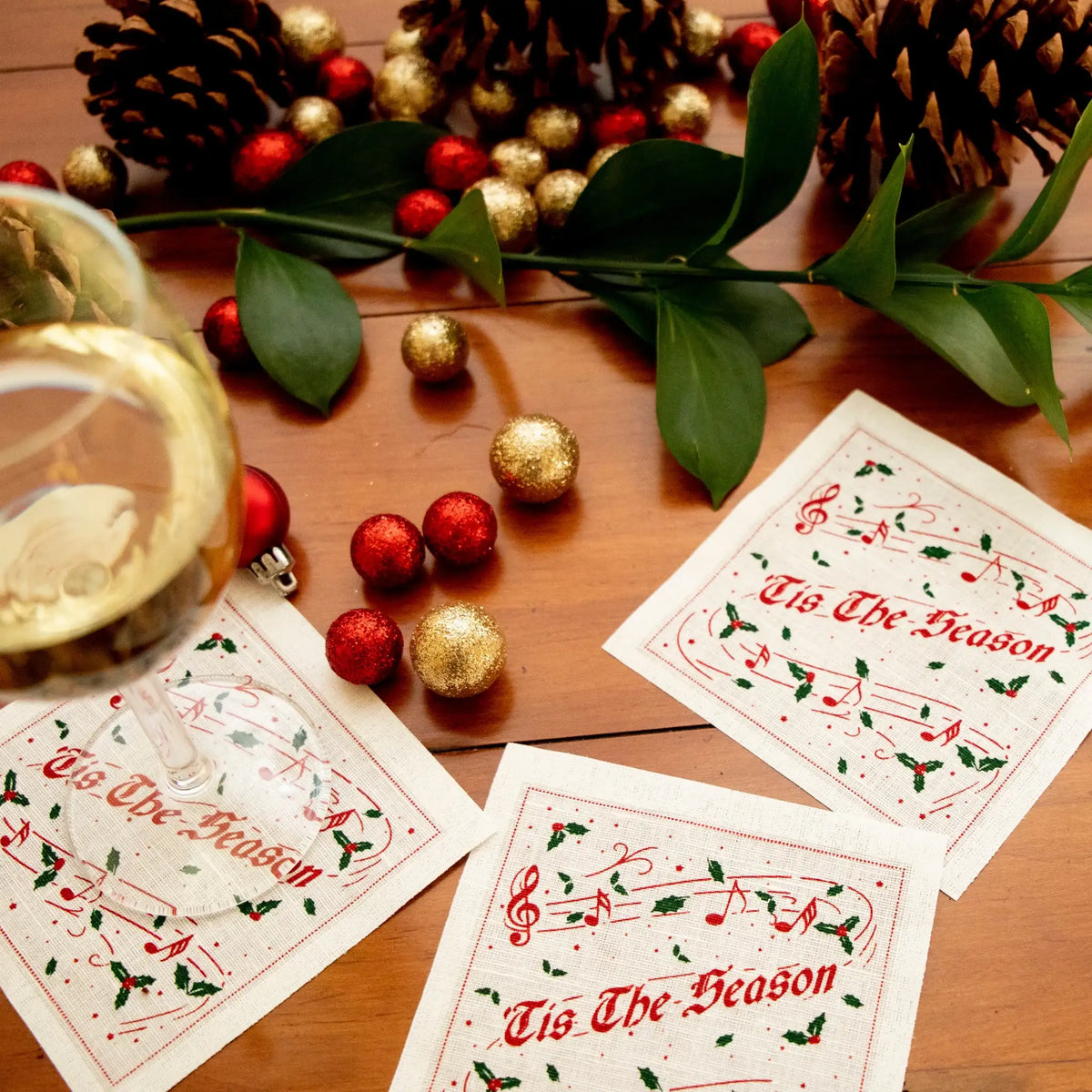Luxury Christmas cocktail napkins with Tis The Season text, festive decor, and wine glass