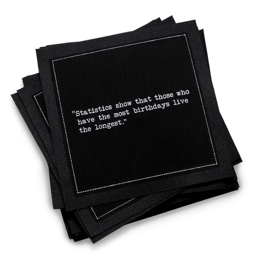 Black luxury cocktail napkin with white birthday quote from Five Star Napkins, organic cotton