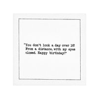 Organic cotton napkin with printed quote: 'You don’t look a day over 16! From a distance, with my eyes closed. Happy birthday!'