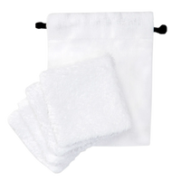 Set of four white organic cotton pads with a matching drawstring pouch