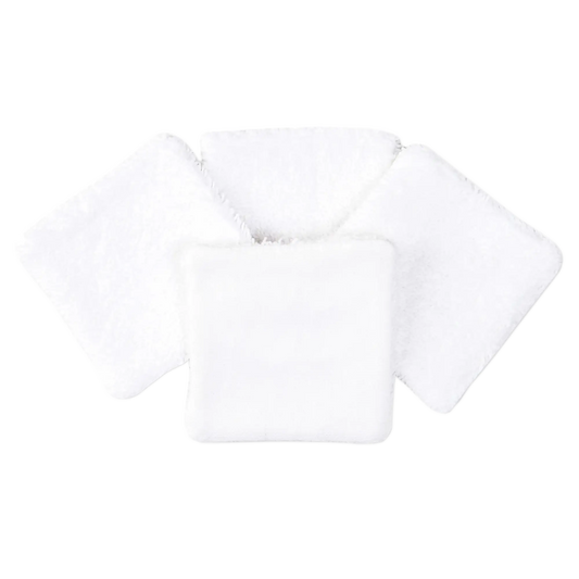 Set of four white organic cotton square pads with soft textured surface, arranged in a fan