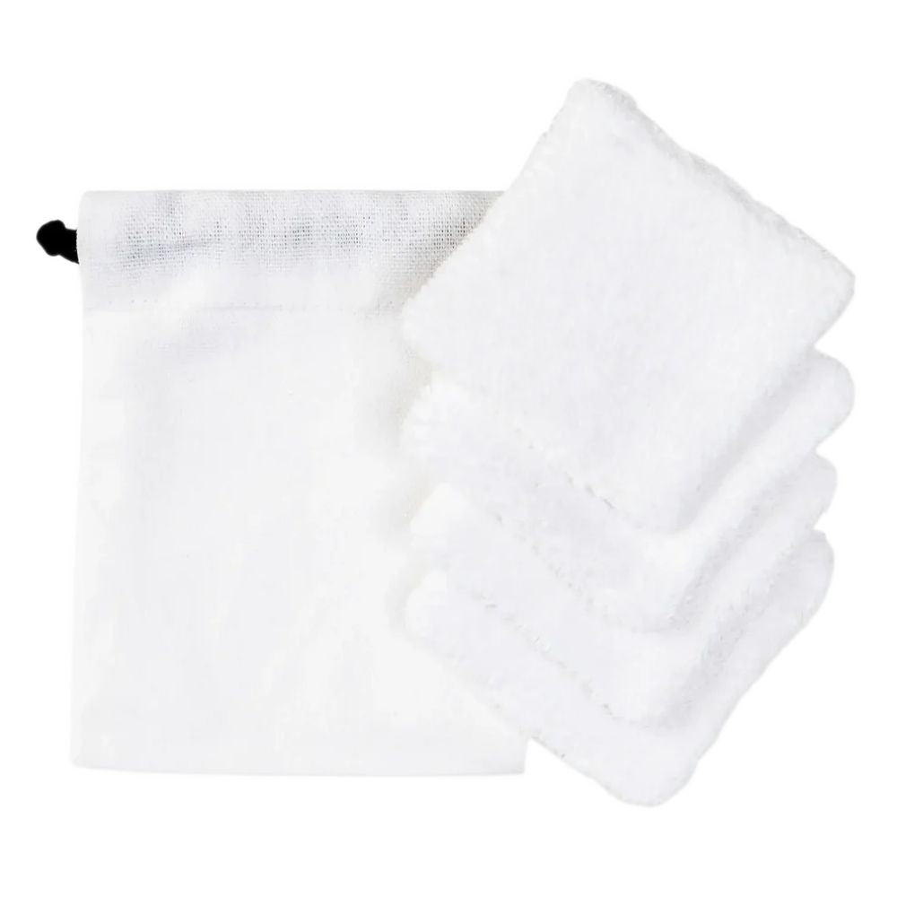 Anthracite grey organic cotton drawstring pouch with a folded stack of white cotton makeup removal rounds beside it.