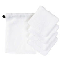 Anthracite grey organic cotton drawstring pouch with a folded stack of white cotton makeup removal rounds beside it.