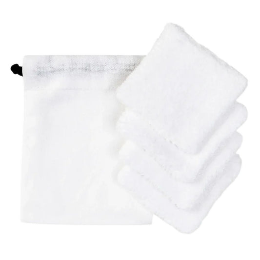 Anthracite grey organic cotton drawstring pouch with a folded stack of white cotton makeup removal rounds beside it.