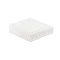 Stack of organic cotton cocktail napkins in Linen White color with stitched border
