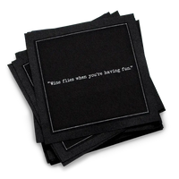 Organic cotton cocktail napkin, black, with white dotted border printed with the quote "Wine flies when you're having fun," from Five Star Napkins' Wine quote collection