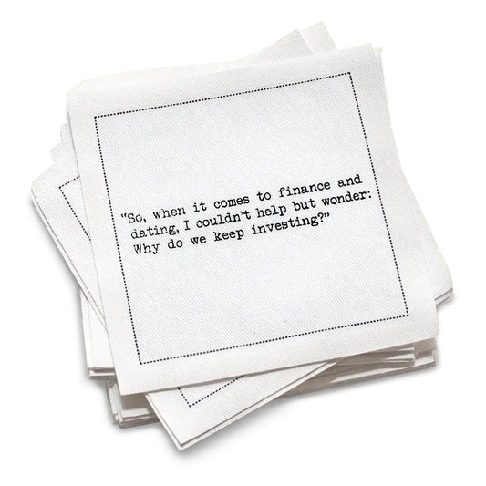 Stack of white cotton cocktail napkins with Carrie Bradshaw Quotes, with black text on a white background
